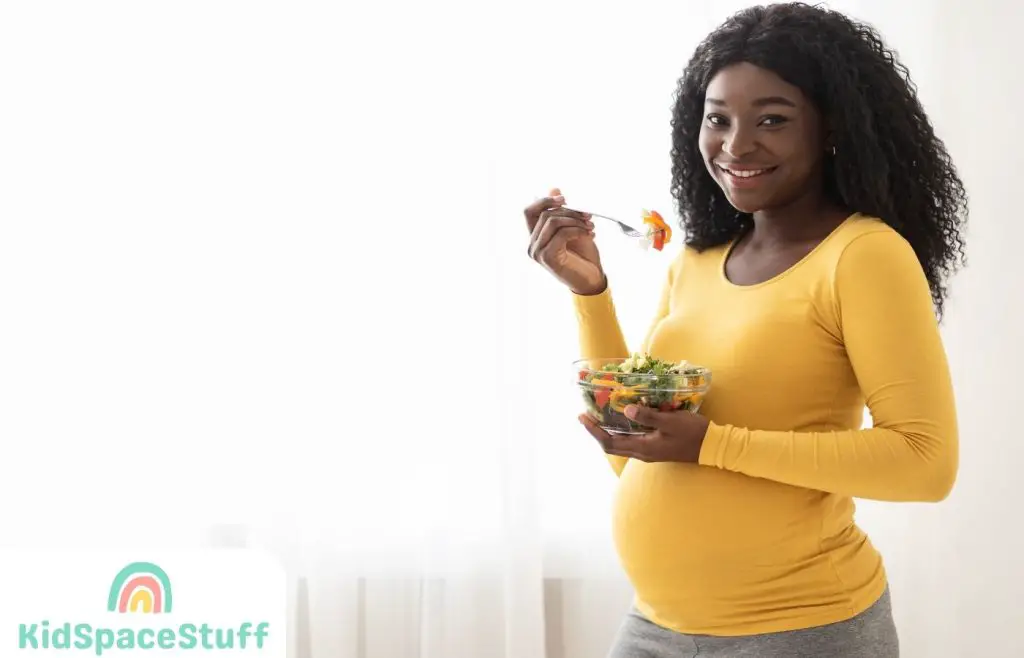 A picture of a woman eating chicken salad