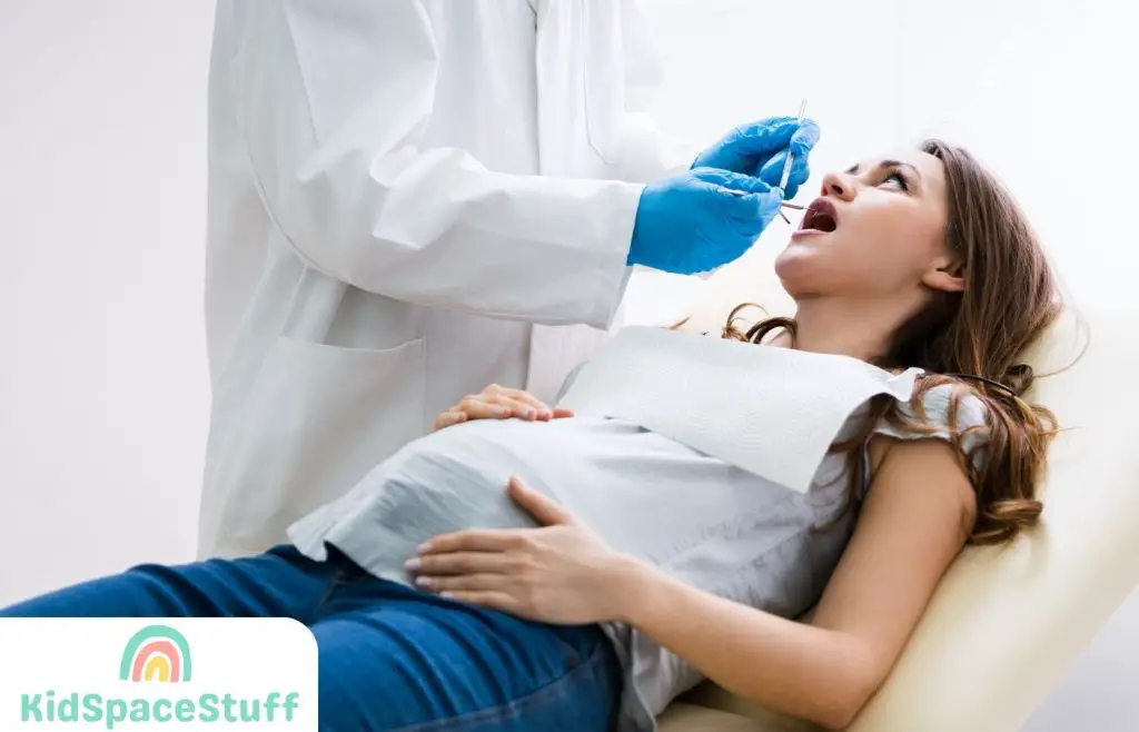 Pregnant Woman Having Teeth Examined At Dentists