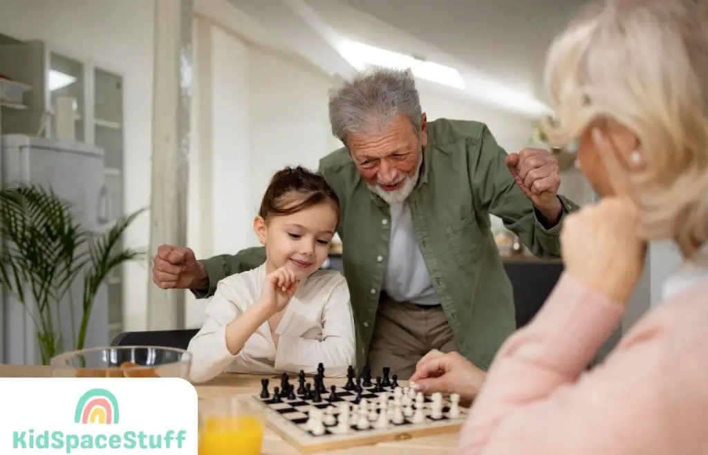 Grandparents teaching a granddaughter how to play chess